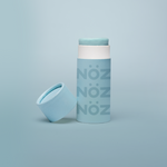 Load image into Gallery viewer, Blue Noz stick sunscreen with the cap off modeled in a Blue background
