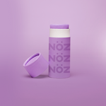 Load image into Gallery viewer, Purple Noz stick sunscreen with the cap off modeled in a purple background
